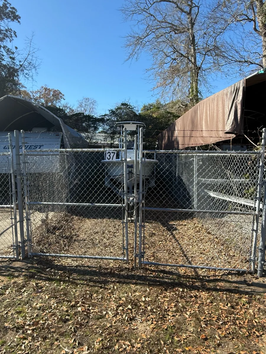 Covered boats behind the gate of storage space 37
